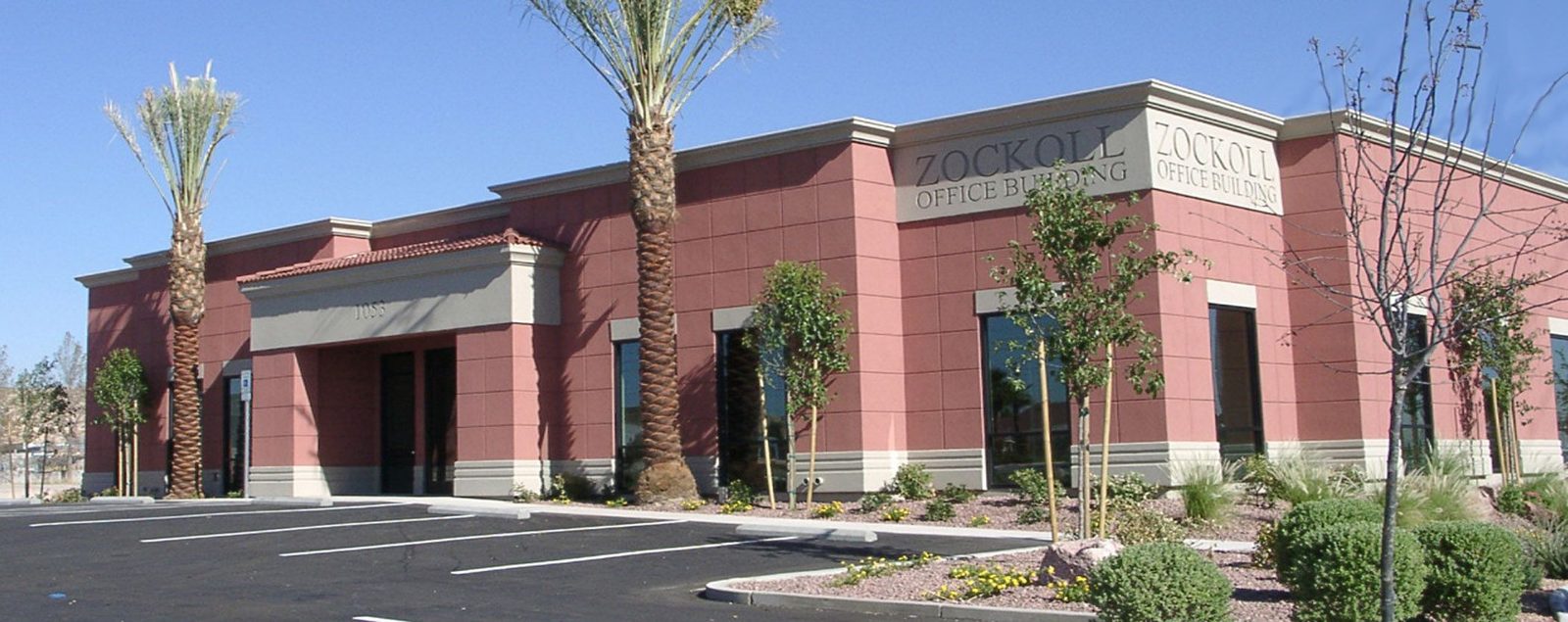 Brick retail building with arched entries